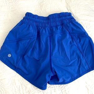 Luluemon blue shorts with lining and front side zipper pocket.